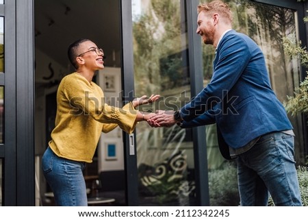 Shaking hands handshake greeting good old friend, client, job professional or new employee, two persons welcoming each other Royalty-Free Stock Photo #2112342245