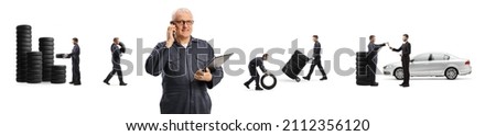 Auto mechanic with a smartphone and other men working with tires behind isolated on white background Royalty-Free Stock Photo #2112356120