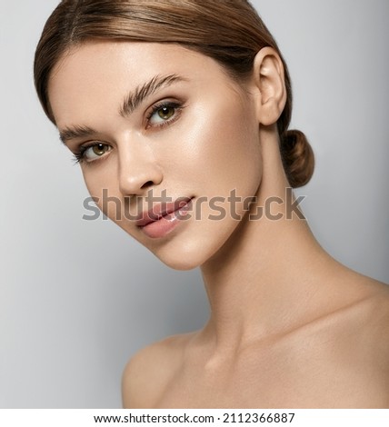 Skin care, beauty portrait. Beautiful caucasian woman with healthy moisturized facial skin and natural plump lips. High quality Royalty-Free Stock Photo #2112366887