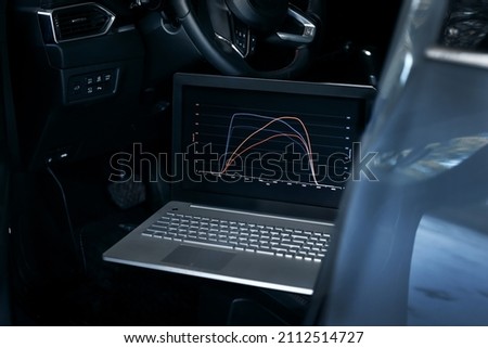 car engine chip tuning, ecu remapping for performance Royalty-Free Stock Photo #2112514727