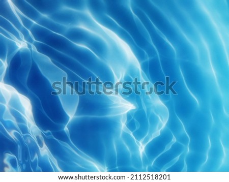Abstract​ of surface​ blue​ water​ for​ background. Reflection​ on surface​ blue​ water​ for​ background. Water​ splashed​ for​ background. Water​ texture​ for​ background. Closeup​​ water texture.