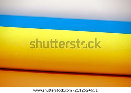 colorful paper rolls form the flag of ukraine