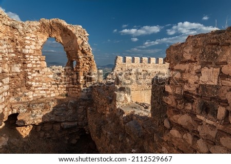 Well-preserved ruins of the ancient Greek fortress Larisa with stone walls and towers, Argos, Greece Royalty-Free Stock Photo #2112529667