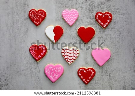 Heart shaped sugar cookies decorated with different designs with royal icing  for valentine's day.