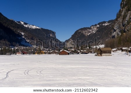 Mountain valley Lauterbrunnen in the Swiss Alps on a sunny winter day with mountain panorama in the background. Photo taken January 15th, 2022, Lauterbrunnen, Switzerland.