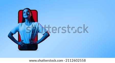 Creative collage. Young beautiful girl sticking out phone screen isolated over blue background. Online acquaintances. Concept of Internet communication, youth culture, modern gadgets