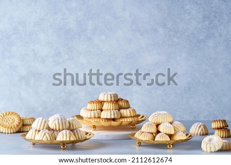 Assorted semolina maamoul or mamoul cookies with dates , walnuts and pistachio nuts. Traditional arabic Eid al Adha, Eid al Fitr sweets . Royalty-Free Stock Photo #2112612674