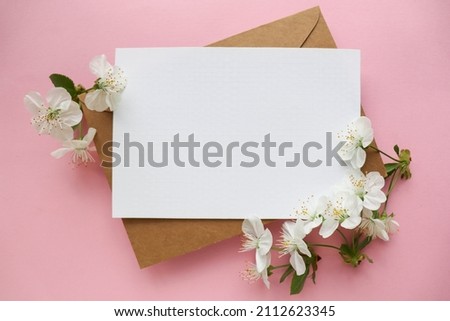 mockup greeting card with spring flowers and envelope. congratulation. invitation