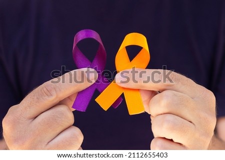 February awareness month campaign with purple and orange ribbon Royalty-Free Stock Photo #2112655403