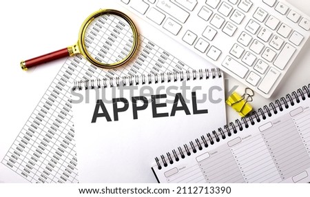 APPEAL text written on the notebook on the chart with keyboard and planning Royalty-Free Stock Photo #2112713390
