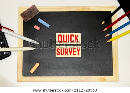 Quick Survey. Speech Bubble on a dark textured wooden background.