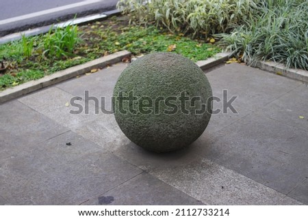 stone ball with blurred background in a sidewalk at Asia-Africa street in Bandung, West Java, Indonesia