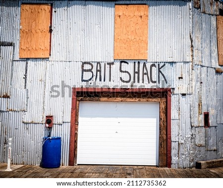 the bait shack on the fishing pier in maine Royalty-Free Stock Photo #2112735362