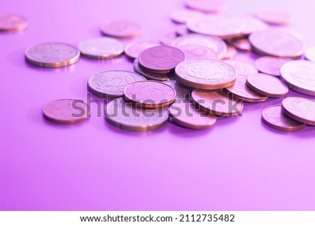 euro coins of different denominations on a lilac background. High quality photo
