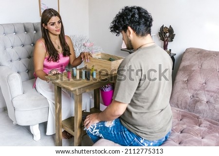 Young latin man in family constellation session with holistic therapist in Latin America Royalty-Free Stock Photo #2112775313