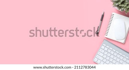 Office desk with keyboard computer, Pen, mouse, notebook on pink background, Top view with copy space, Mock up.
