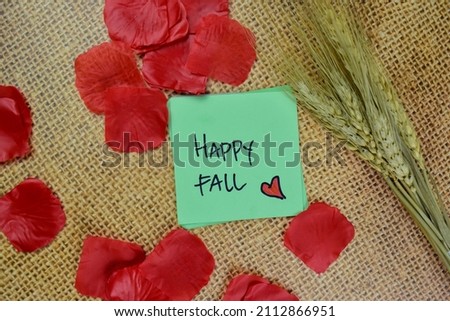 Happy Fall write on sticky notes isolated on Wooden Table.