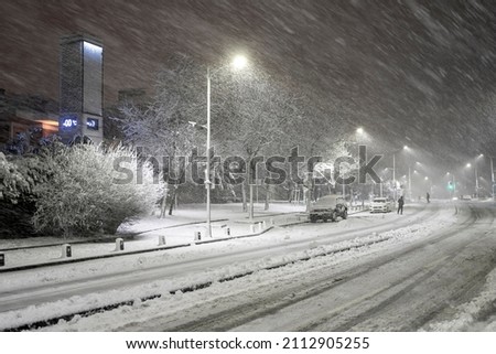 Snow cityscape of a street in Istanbul Turkey with a blizzard.
Winter snowstorm 2022 in Istanbul. A snow-covered road with people and cars in a storm. Royalty-Free Stock Photo #2112905255
