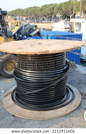 construction site with wooden reel with fiber cables