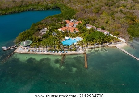 Tropical paradise white sand beach and relaxation zone on the island aerial view