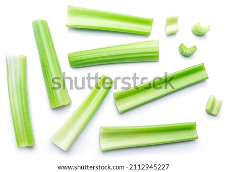 Pile of celery ribs isolated on white background. Royalty-Free Stock Photo #2112945227