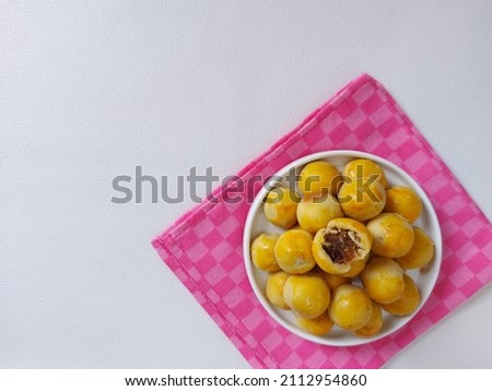 Pineapple tart or nanas tart or nastar cookies. cookies with pineapple jam inside. Very popular for Eid al Fitr and other special moment. Isolated background in white.  Royalty-Free Stock Photo #2112954860