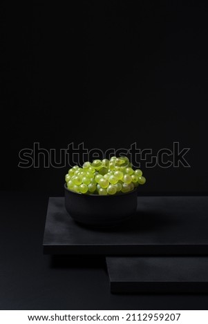 Bunch of grapes for Spanish Verdejo white wine in a bowl on black background