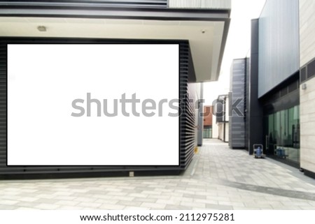 Blurred business centre with very large advertising space ideal for marketing concept, virtual communication with customer. Huge video wall display mock up at an outdoor location