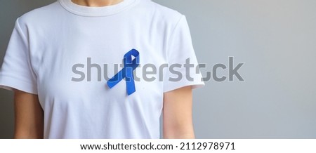 March Colorectal Cancer Awareness month,  dark Blue Ribbon for supporting people living and illness. Healthcare, hope and World cancer day concept