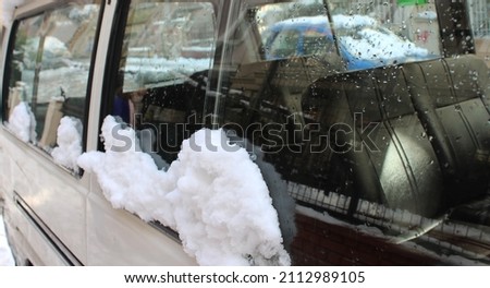 photo of melting snow on a vintage van