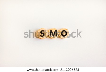 SMO, social media optimization symbol. Concept word SMO - social media optimization on wooden circles on beautiful white background, copy space. Business, SMO - social media optimization concept.