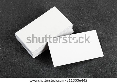 Photos of business cards. Mock-up for corporate identity on a black background. For graphic designers presentations and portfolios
