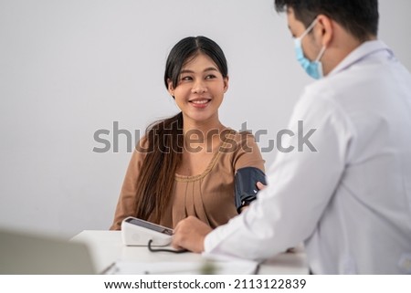 Asian pregnant woman visit gynecologist doctor at hospital for pregnancy consultant Royalty-Free Stock Photo #2113122839