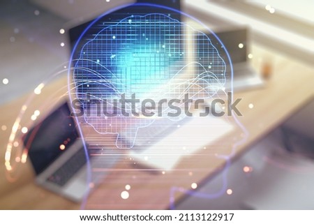 Double exposure of creative human head microcircuit and modern desk with computer on background. Future technology and AI concept