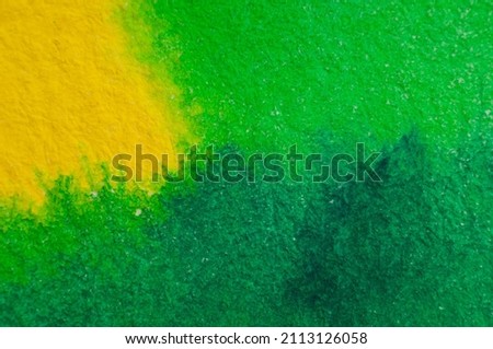 Watercolor background in yellow and green with pronounced paper texture.