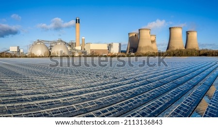 An aerial view of Drax Power Station and the greenhouses that grow salad and vegetables from the excess heat that the power station uses Royalty-Free Stock Photo #2113136843