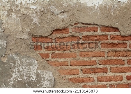 red brick wall with cracked part, old brick wall background 