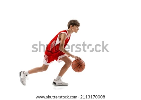 Match preparation. Portrait of professional basketball player dribbling ball in motion, training isolated over white background. Concept of sport, active lifestyle, health, team game and ad Royalty-Free Stock Photo #2113170008