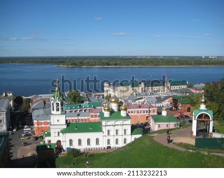 macro photo with decorative background of river perspective and urban historical infrastructure with churches and houses in the Russian city of Nizhny novgorod for design as a source for prints