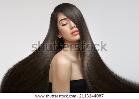 Fashion woman with straight long shiny hair. Beauty and hair care Royalty-Free Stock Photo #2113244087