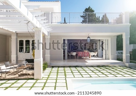 Paving stones at poolside patio of luxury house