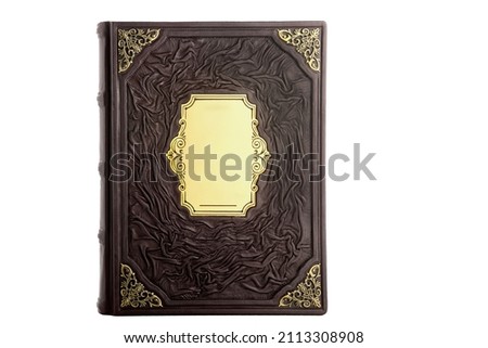 Brown Black Gold Leather mockup book with cover color isolated on white background, front view. With empty lable and metal fittings. Royalty-Free Stock Photo #2113308908