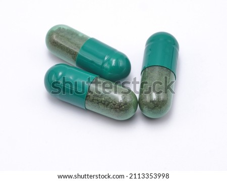 Green capsule pills on white background. Large image. Suitable for you who need high resolution. and public health work.