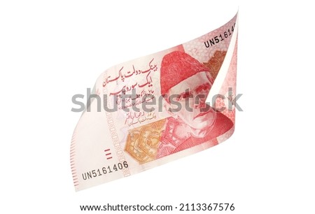 Rs 100 Pakistani Rupees Bank note curled on both sides on white background -Money - finance -currency Royalty-Free Stock Photo #2113367576
