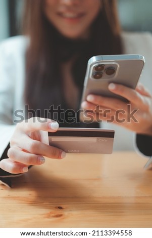 Woman enjoy with online shopping application and typing credit card for fill number to payment with virtual digital asset and metaverse.