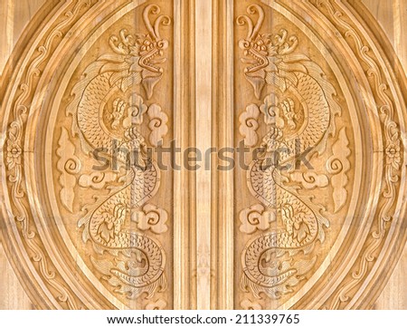 Pattern of dragon carved on the wooden texture