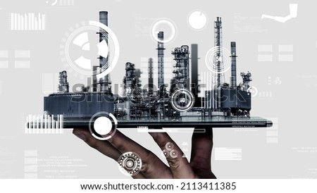 Future factory plant and inventive energy industry concept in creative graphic design. Oil, gas and petrochemical refinery factory with hologram showing next generation of power and energy business.