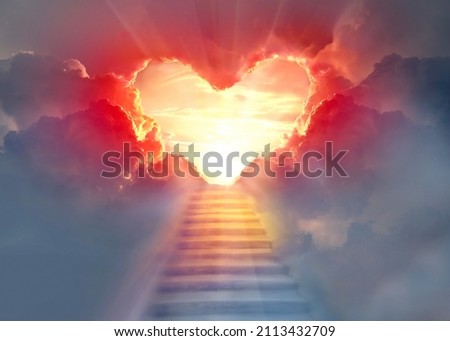 Stairway to Heaven.Stairs in sky.  Concept with sun and clouds.  Religion  background. Red heart shaped sky at sunset. Love background with copy space. Royalty-Free Stock Photo #2113432709