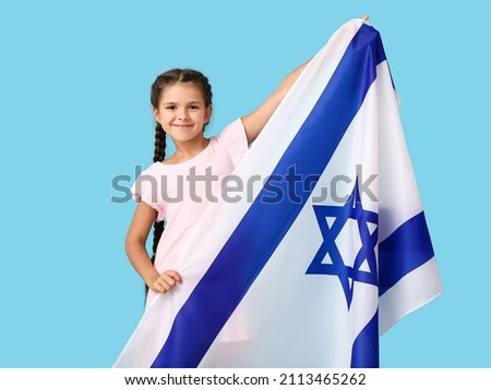 Little girl with the flag of Israel on color background Royalty-Free Stock Photo #2113465262