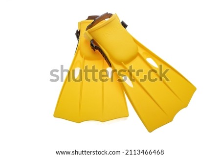 Flippers yellow isolated cutout on white background. Overhead view of pair of fin footwear, swim and dive sea equipment. Sport, activity, leisure. Royalty-Free Stock Photo #2113466468